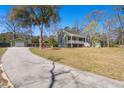 Well-maintained home with a detached garage, complemented by a spacious driveway at 146 Picard Dr, Ladson, SC 29456