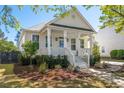 Attractive home with a classic design, front porch, and vibrant landscaping at 171 Cartright St, Charleston, SC 29492
