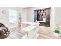 Bright foyer with a built-in storage bench and coat rack, perfect for organization at 187 Red Blf St, Summerville, SC 29483