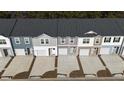 An aerial view of newly constructed townhomes showcases varied exterior paint and landscaping details at 1903 Scarlett Maple St, Summerville, SC 29486
