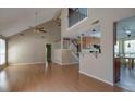 Open-concept living room with hardwood floors, high ceilings, and lots of natural light at 2612 Morning Dove Ln, Charleston, SC 29414