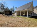 Exterior shot of a garage with an open carport area connected to the main building at 305 Sandridge Rd, Dorchester, SC 29437
