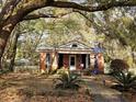 Charming brick home with mature trees and a well-manicured lawn at 306 Perry Rd, Walterboro, SC 29488