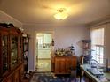 Open-plan living room featuring wood floors with built-in bar at 306 Perry Rd, Walterboro, SC 29488