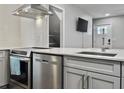 Modern kitchen featuring stainless steel appliances, white subway tile, and a breakfast bar at 33 Athens Ct, Charleston, SC 29403