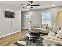 Cozy living area with wood floors, comfortable seating, and view of the bright outdoors at 33 Athens Ct, Charleston, SC 29403