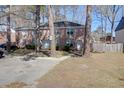 Brick townhouse with parking area and landscaping in a residential neighborhood at 406 Crestview Dr # D, Summerville, SC 29485