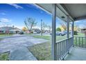 View from the porch of this house showcasing the neighborhood street and surrounding homes on a sunny day at 425 Miami St # A, Ladson, SC 29456