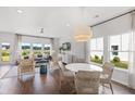 Spacious living space with hardwood floors, modern furniture, and a view of the outdoors at 579 Red Monarch Way, Moncks Corner, SC 29461