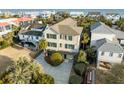 Sprawling home with neat landscaping and backyard views of the ocean and surrounding neighborhood at 707 Ocean Blvd, Isle of Palms, SC 29451