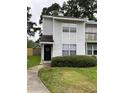 Charming townhouse with a well-maintained lawn and inviting curb appeal at 7851 Sandida Ct, North Charleston, SC 29418
