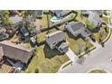 Aerial view of a home in a residential neighborhood with a well-maintained lawn and mature trees at 8005 Old Hazelwood Rd, North Charleston, SC 29406