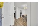 Bright entryway showcasing new flooring, modern lighting, and easy access to the kitchen at 9712 Transplanter Cir, Ladson, SC 29456
