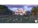 A beautiful two-story home with a metal roof situated in a tranquil, natural setting at 1077 Ship Builder St, Charleston, SC 29492