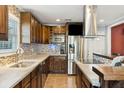 Modern kitchen featuring stainless steel appliances, tile backsplash, and ample counter space at 115 Laurel Ridge Rd, North Charleston, SC 29418