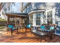 Relaxing outdoor patio with comfortable wicker furniture and a screened-in porch at 115 Laurel Ridge Rd, North Charleston, SC 29418