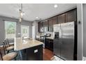 Modern kitchen featuring stainless steel appliances, granite countertops, and an island with seating at 1800 Poplar Grove Pl, Summerville, SC 29483