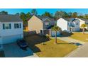 Two-story home with a well-manicured lawn, curb appeal, and an attached two-car garage and palm tree at 206 Cypress Plantation Rd, Moncks Corner, SC 29461