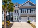 Charming exterior of a two-story townhouse with well-manicured landscaping at 2142 Oyster Reef Ln, Mount Pleasant, SC 29466