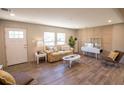 A well-lit living room showcases cozy furniture, wood flooring, and neutral wall colors at 2293 Old Hwy 6, Cross, SC 29436
