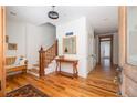 Inviting foyer with wood floors, staircase, and elegant entryway furniture, creating a warm welcome at 263 Pelican Flight Dr, 15.4% Share, Dewees Island, SC 29451