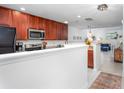 A well-lit kitchen featuring ample counter space, a microwave, and a refrigerator, seamlessly connecting to the living area at 275 Kelsey Blvd, Charleston, SC 29492