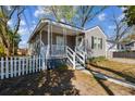Charming grey home with a cozy front porch and a classic white picket fence at 2925 Alabama Dr, North Charleston, SC 29405
