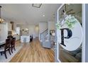 Bright, open floorplan featuring beautiful hardwood floors connecting the kitchen, living area and staircase at 3522 Habenaria Rd, Mount Pleasant, SC 29466
