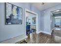 Stylish entryway showcasing hardwood floors, decorative artwork, and an open view into the dining area at 3537 Sewel Ave, Mount Pleasant, SC 29466