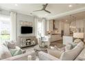 Bright living room featuring modern furnishings, neutral decor, and large windows at 4021 Flatiron Dr, Charleston, SC 29414