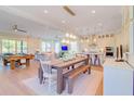 Open-concept living space with dining table, kitchen, and entertainment area at 4021 Flatiron Dr, Charleston, SC 29414