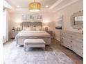 Elegant main bedroom with a neutral color scheme, stylish furnishings, and soft lighting at 4021 Flatiron Dr, Charleston, SC 29414