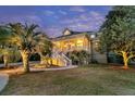 Charming home with a welcoming front porch and well-manicured lawn at 4051 Colonel Vanderhorst Cir, Mount Pleasant, SC 29466
