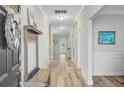 Hallway featuring neutral walls and hardwood floors at 5415 Clairmont Ln, North Charleston, SC 29420