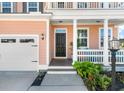 A close-up of the front porch showing the entry and the two car garage at 543 Pendleton Dr, Moncks Corner, SC 29461