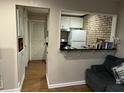 A well-lit kitchen features white cabinetry, modern appliances, and a convenient pass-through to the living area at 6601 Dorchester Rd # 109, North Charleston, SC 29418