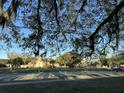 A view of a charming church with a manicured circular lawn, trees, and parked cars nearby at 6601 Dorchester Rd # 109, North Charleston, SC 29418