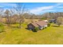 Sprawling property showcases a cozy brick home, nestled in a lush green landscape at 729 2Nd Bend Rd, Harleyville, SC 29448