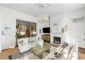 Comfortable living room featuring a fireplace, mantle, and TV at 115 Rutledge Ave # A, Charleston, SC 29401