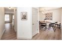 Bright dining area with modern chandelier and stylish decor open to a hallway with wood flooring at 122 Moon Shadow Ln, Summerville, SC 29485