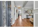 Inviting foyer with hardwood floors, neutral walls, elegant wainscoting, and decorative details throughout at 219 Daybreak Blvd, Summerville, SC 29486