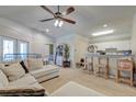 Bright living room with carpet, ceiling fan, neutral paint, and lots of seating near the kitchen at 2434 Egret Crest Ln, Charleston, SC 29414