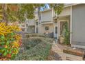 Charming townhome exterior with lush landscaping, colorful foliage, and inviting curb appeal at 2765 Jobee Dr # 1303, Charleston, SC 29414