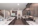 Modern kitchen with stainless steel appliances, granite countertops, tile backsplash, and ample cabinet space for a chef's dream at 332 Calm Water Way, Summerville, SC 29486