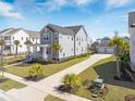 Stylish two-story home featuring a long driveway, detached garage, and well-maintained landscaping at 3785 Summerton St, Mount Pleasant, SC 29466