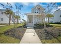 Inviting two-story home featuring a spacious front porch, manicured lawn, and sidewalk leading to the entrance at 3785 Summerton St, Mount Pleasant, SC 29466