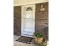 Welcome to the front porch of this cozy home, complete with a decorative welcome mat and brick accents at 391 Furman Ln, Ladson, SC 29456
