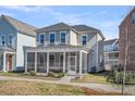 Inviting two-story home showcasing a large screened-in porch, enhancing outdoor living at 4603 Scout Aly, North Charleston, SC 29405