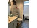 Well-lit bathroom with a shower-tub combo and modern fixtures, with tiled floors at 4800 Wheatfield Dr, Summerville, SC 29485