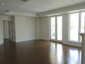 Bright living room features hardwood floors, large windows, and ample natural light at 5009 Old Bridgeview Ln # 5009, Charleston, SC 29403